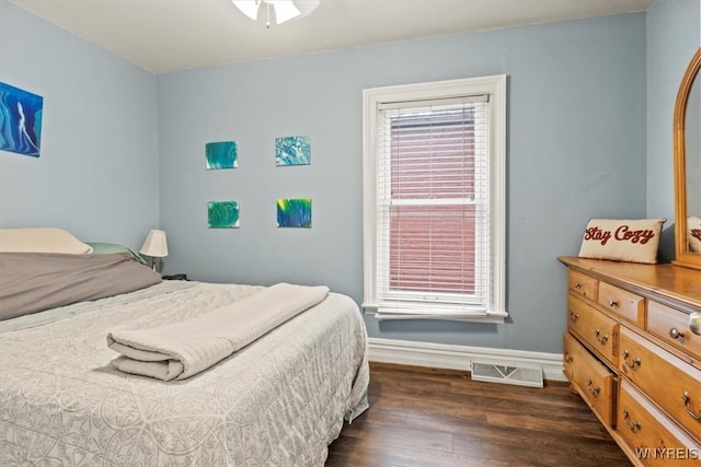 bedroom featuring dark hardwood / wood-style flooring