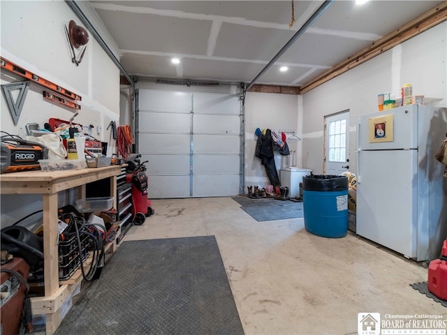 garage featuring white fridge