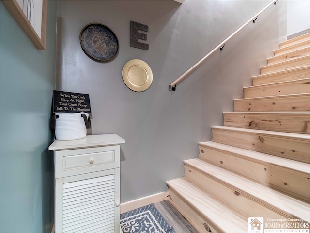 stairway with wood-type flooring