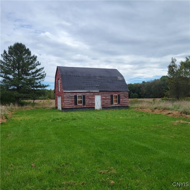 back of property with a lawn