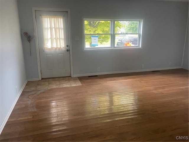 foyer entrance with light hardwood / wood-style floors