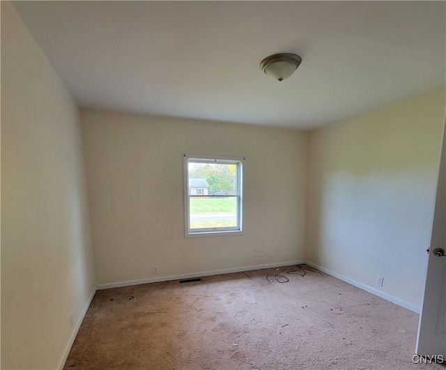 empty room with light colored carpet