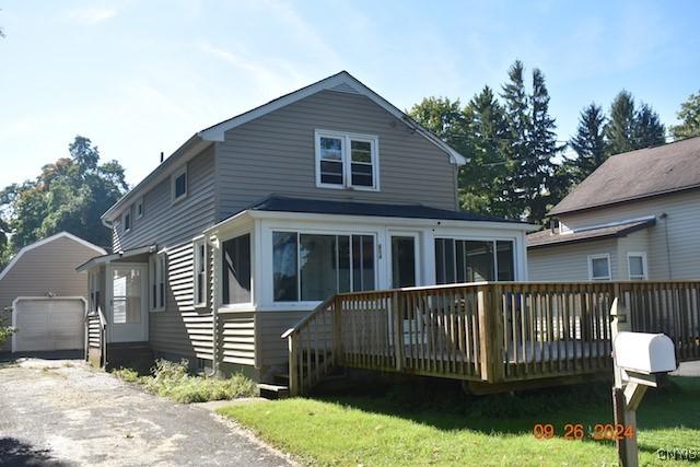 604 Oneida Lake Ave, Sullivan, NY 13032 - view of front facade with a deck, an outbuilding, and asphalt driveway