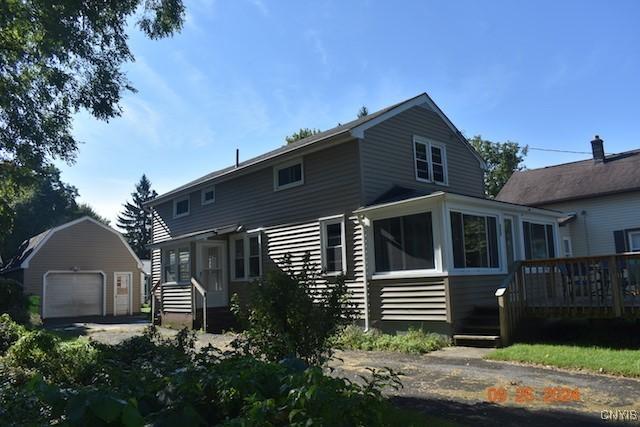 604 Oneida Lake Ave, Sullivan, NY 13032 - back of house with an outdoor structure, a garage, and a deck