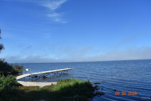 property view of water featuring a dock