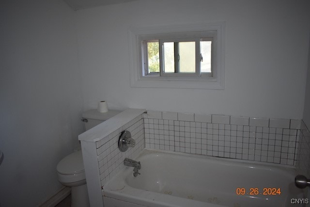 bathroom with a bathtub and toilet