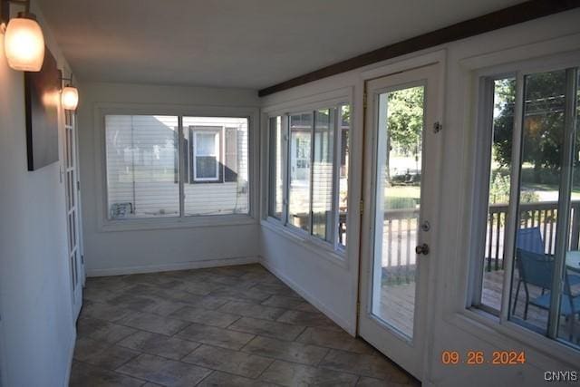 604 Oneida Lake Ave, Sullivan, NY 13032 - unfurnished sunroom with stone finish floors and baseboards