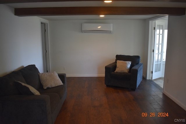 living room with beam ceiling, dark hardwood / wood-style floors, and a wall mounted AC