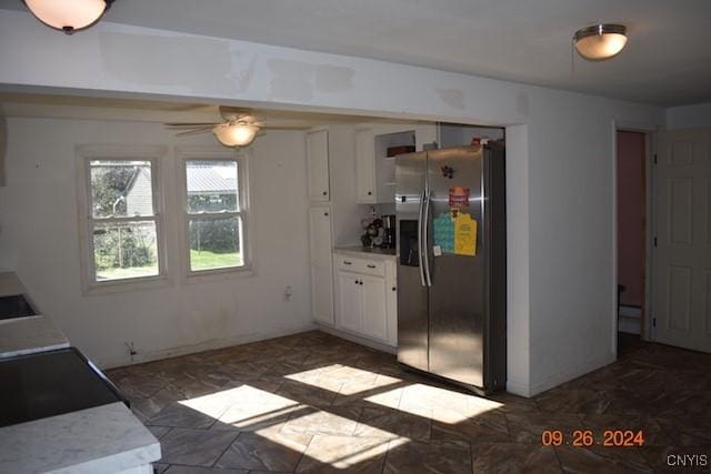 604 Oneida Lake Ave, Sullivan, NY 13032 - kitchen featuring stainless steel fridge with ice dispenser, white cabinets, light countertops, and a ceiling fan