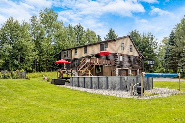 rear view of house featuring a yard