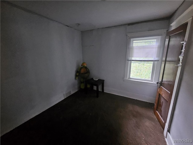 unfurnished room featuring dark hardwood / wood-style floors