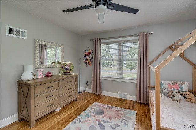 bedroom featuring light hardwood / wood-style floors and ceiling fan