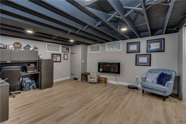 interior space featuring light hardwood / wood-style floors and beam ceiling