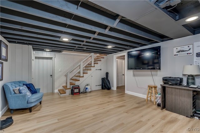 basement with light hardwood / wood-style floors