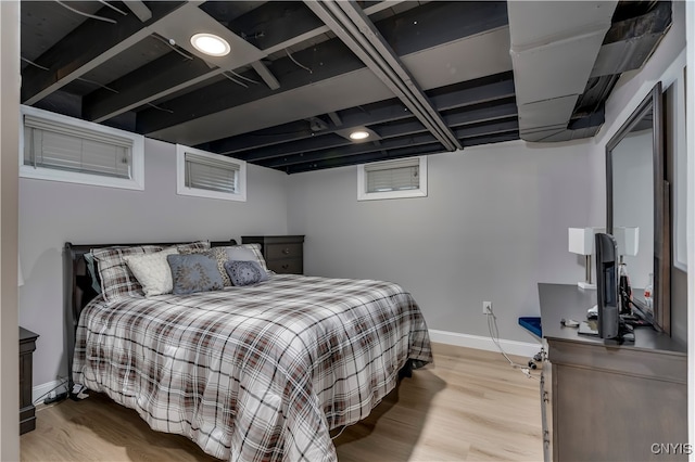 bedroom with light wood-type flooring