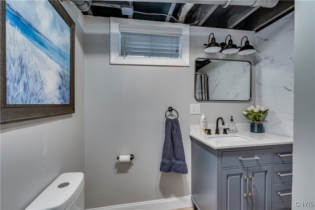 bathroom with vanity and toilet