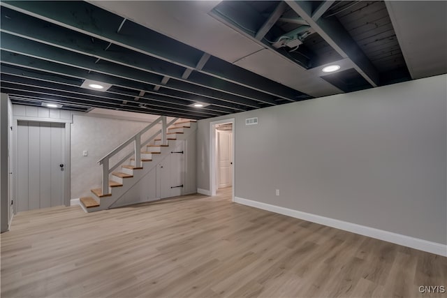 basement featuring light hardwood / wood-style flooring