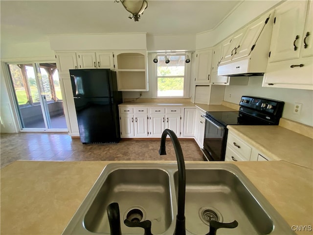 kitchen featuring white cabinets, black appliances, and sink