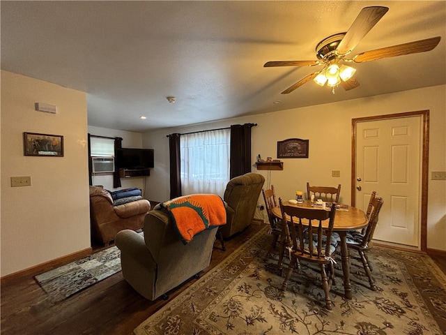 dining room with ceiling fan, cooling unit, and hardwood / wood-style floors