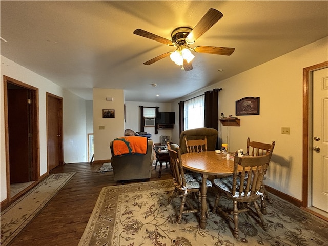 dining room featuring ceiling fan and dark hardwood / wood-style flooring