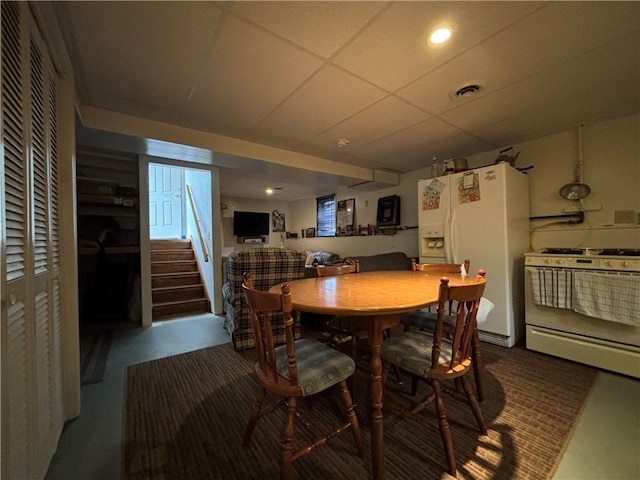 dining area with a paneled ceiling