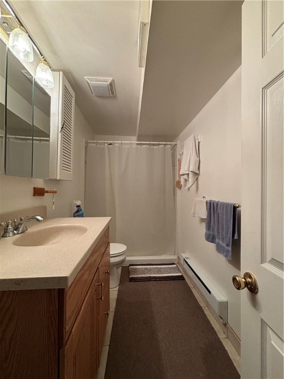 bathroom with walk in shower, vanity, toilet, and a baseboard heating unit