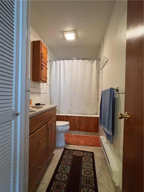 full bathroom with vanity, shower / bath combo, a baseboard radiator, toilet, and tile patterned floors