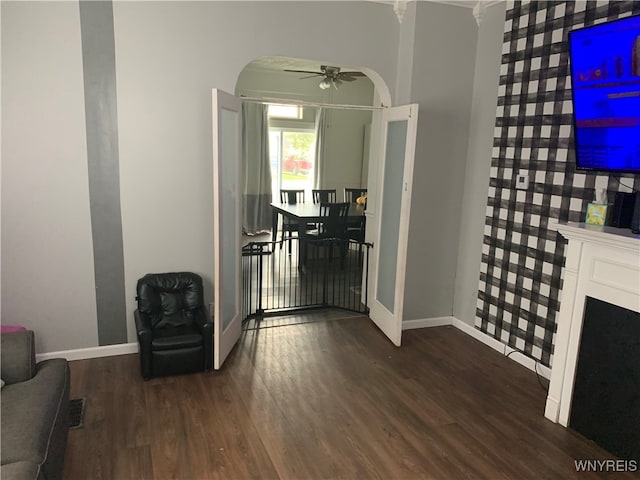 foyer featuring ceiling fan and dark wood-type flooring