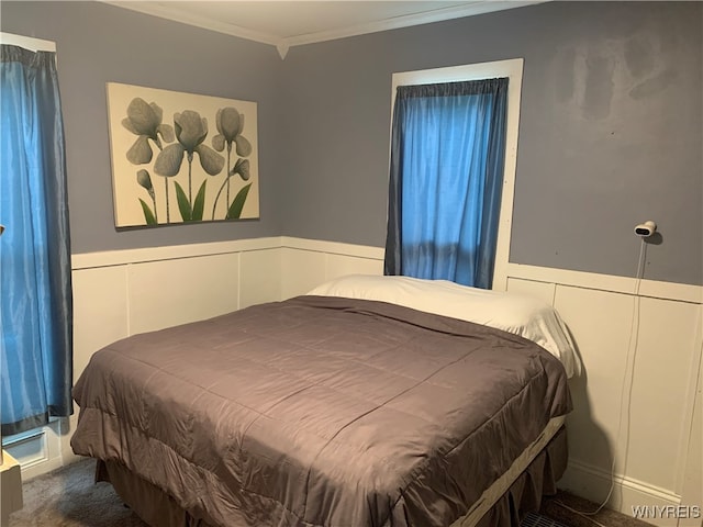 bedroom with crown molding