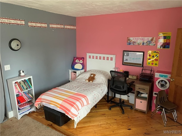 bedroom featuring hardwood / wood-style flooring