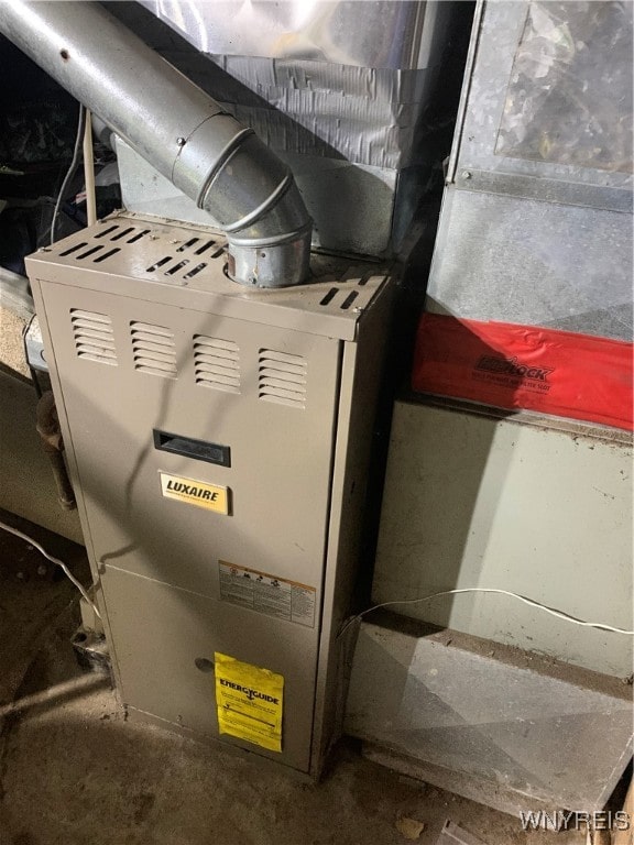 utility room with heating unit