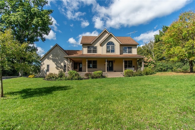 view of front of home with a porch and a front yard