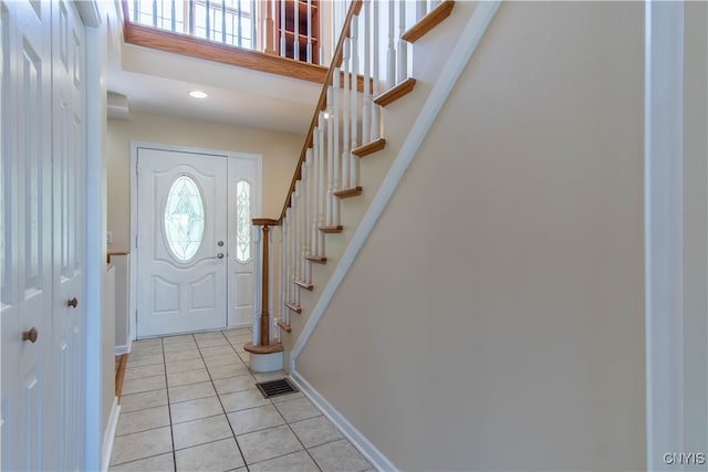 foyer with light tile patterned flooring