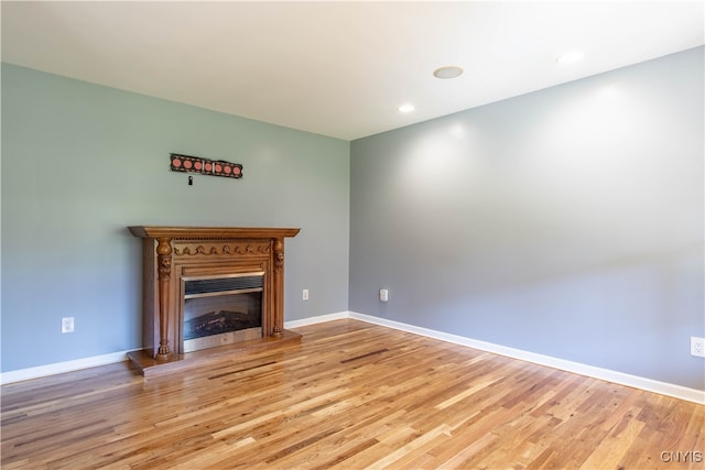 unfurnished living room with light hardwood / wood-style floors