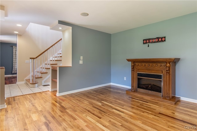 unfurnished living room with light wood-type flooring