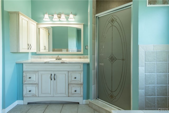 bathroom with vanity, an enclosed shower, and tile patterned floors