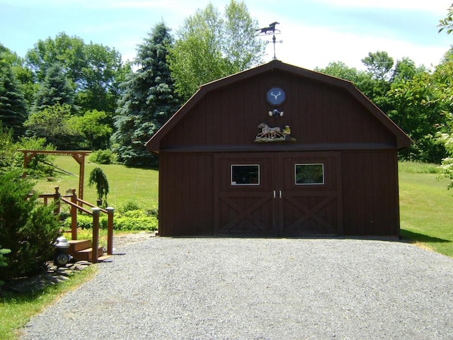 view of outbuilding with a lawn