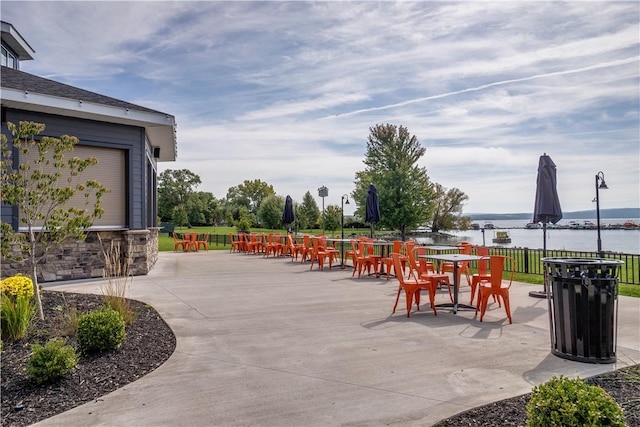 205 Lakeshore Dr Unit 520, Canandaigua City, NY 14424 - view of patio featuring outdoor dining area and a water view