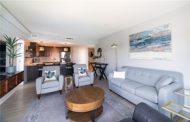 205 Lakeshore Dr Unit 520, Canandaigua City, NY 14424 - living room featuring light wood-style flooring
