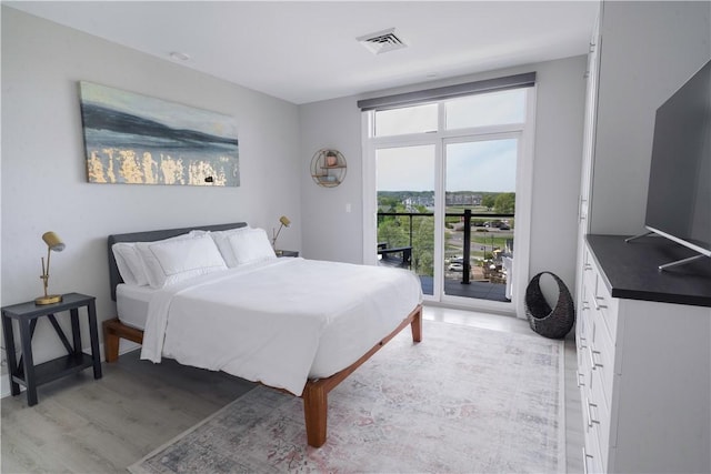 205 Lakeshore Dr Unit 520, Canandaigua City, NY 14424 - bedroom featuring access to outside and light wood-type flooring