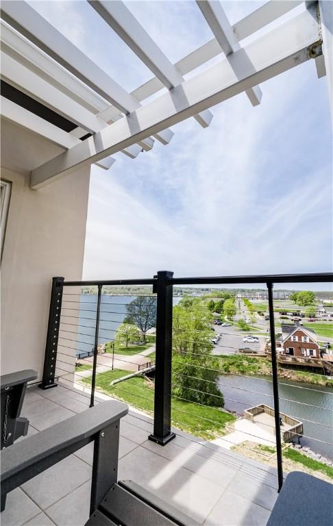 205 Lakeshore Dr Unit 520, Canandaigua City, NY 14424 - balcony featuring a water view and a pergola