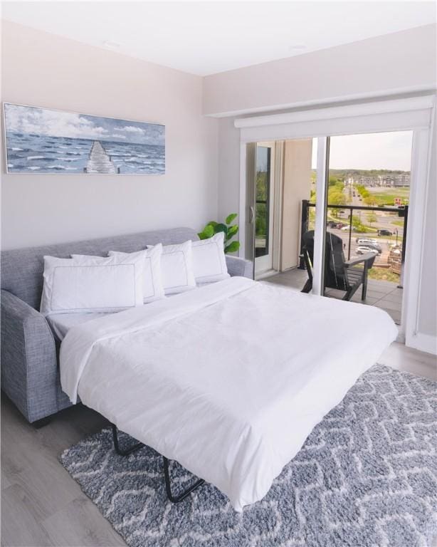 205 Lakeshore Dr Unit 520, Canandaigua City, NY 14424 - bedroom with access to outside and wood finished floors