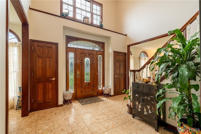 foyer featuring a high ceiling