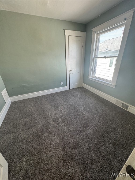 empty room featuring carpet flooring