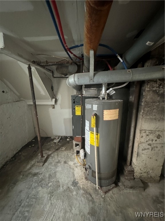 utility room featuring water heater