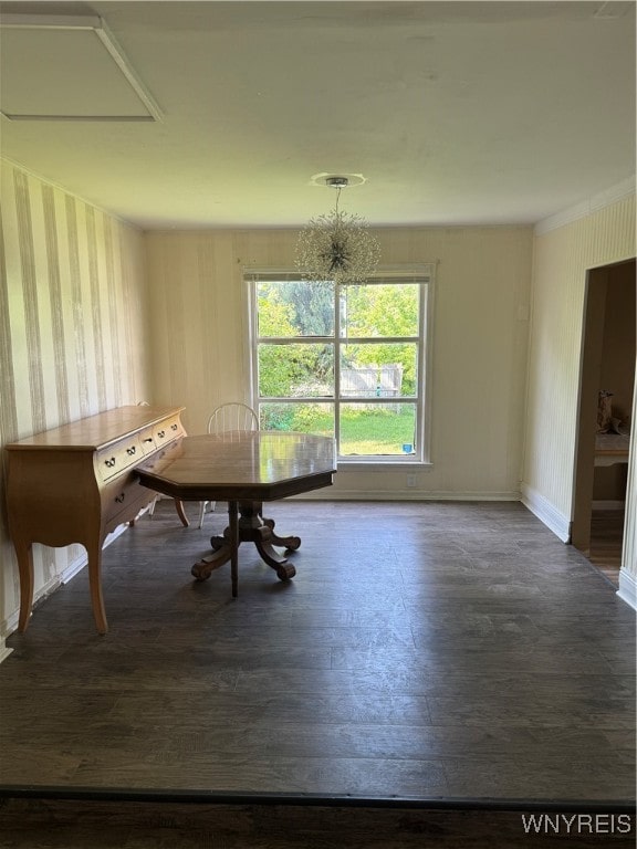 unfurnished dining area with an inviting chandelier and dark wood-type flooring