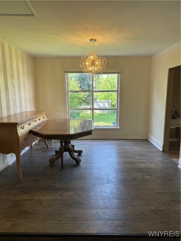 unfurnished dining area featuring an inviting chandelier and dark hardwood / wood-style flooring