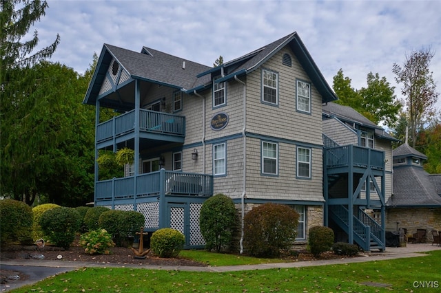 back of property with a balcony