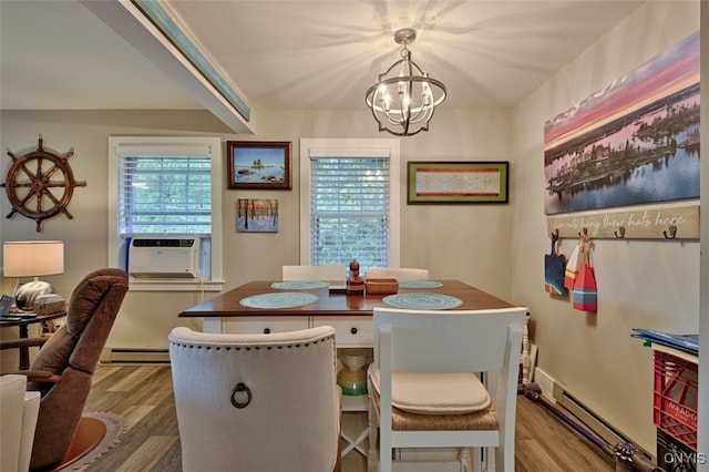 dining area with a baseboard radiator, wood-type flooring, a notable chandelier, and cooling unit