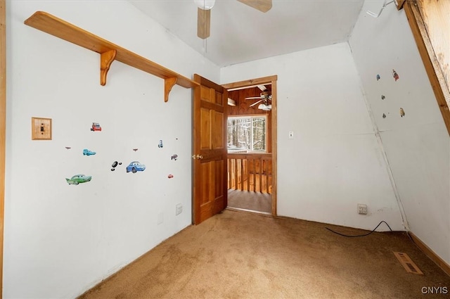 carpeted empty room with ceiling fan